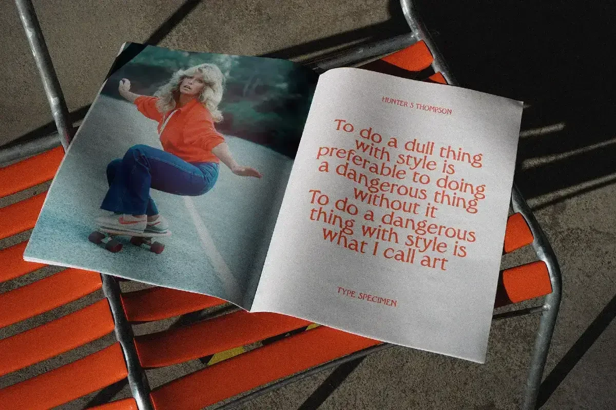 Open magazine with a photo of a woman skateboarding, paired with a Hunter S. Thompson quote in bold retro typography.