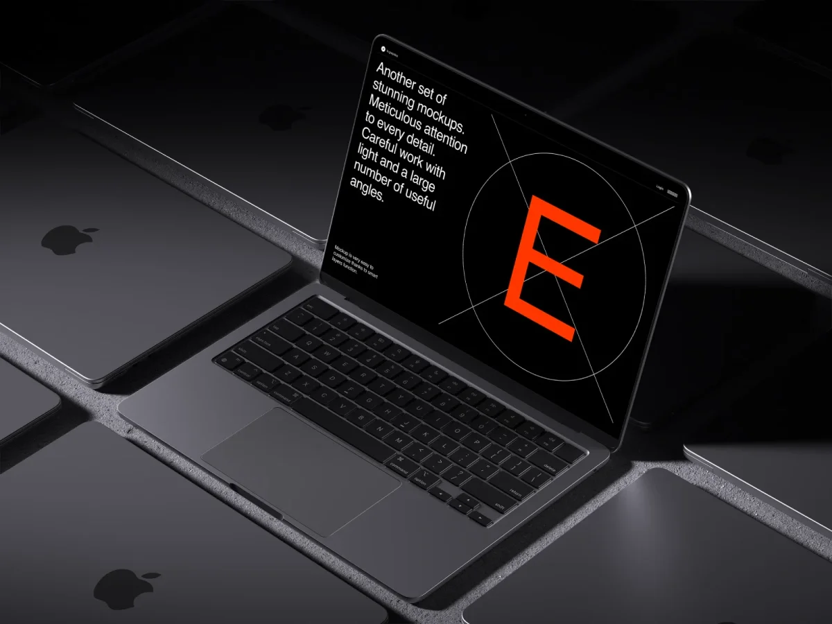 A MacBook Air with a black screen is surrounded by multiple closed MacBooks with the Apple logo, all set against a matte black background, emphasizing a sleek and professional setting for web and app design displays.