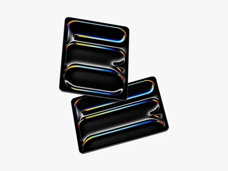 Two iPad Pro mockups placed on a white surface, featuring a vibrant reflective pattern on their screens, creating a sleek and modern aesthetic.