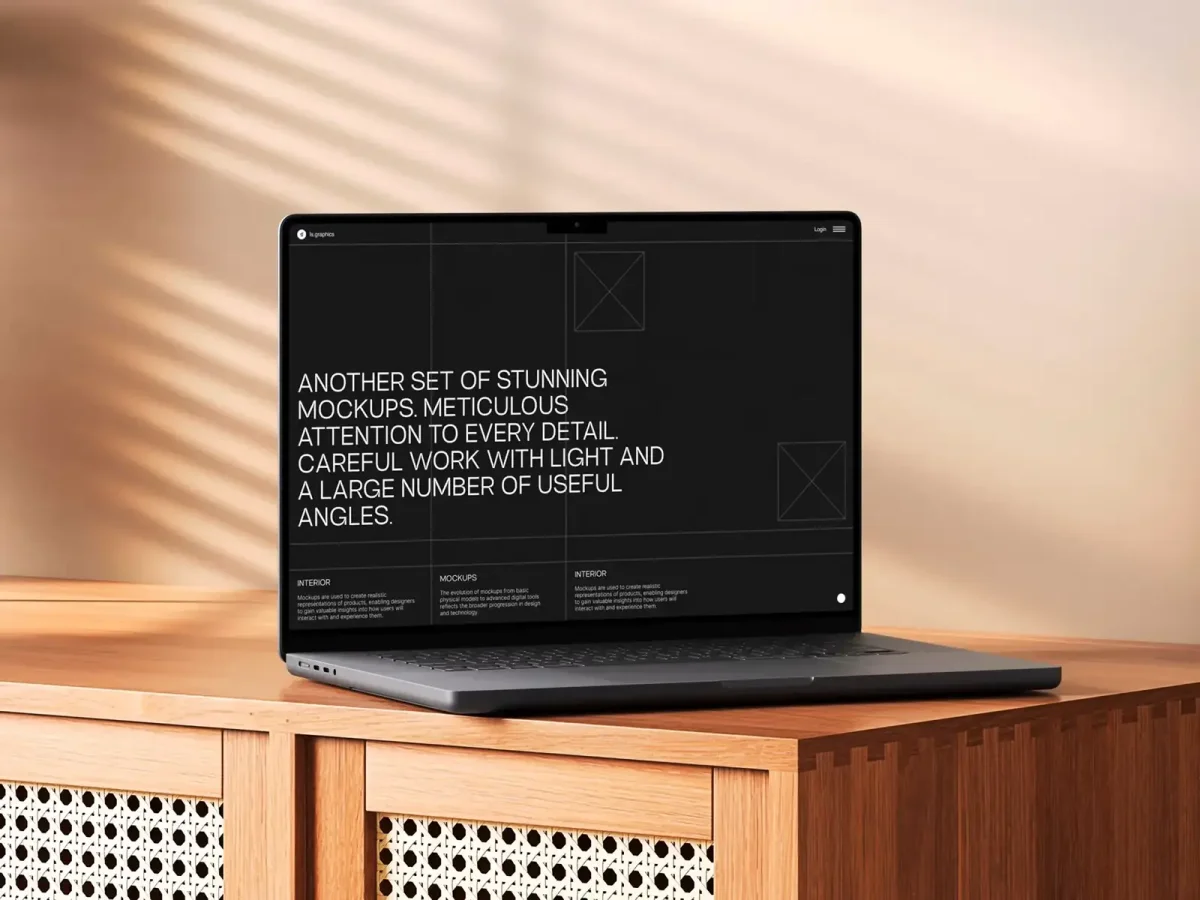 A MacBook on a wooden table displaying a modern website mockup with a black background and bold text promoting design and mockup features.