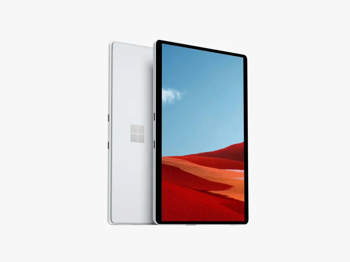Two Surface Pro devices, one showing the desert landscape and the other showcasing the white back panel with the Microsoft logo.