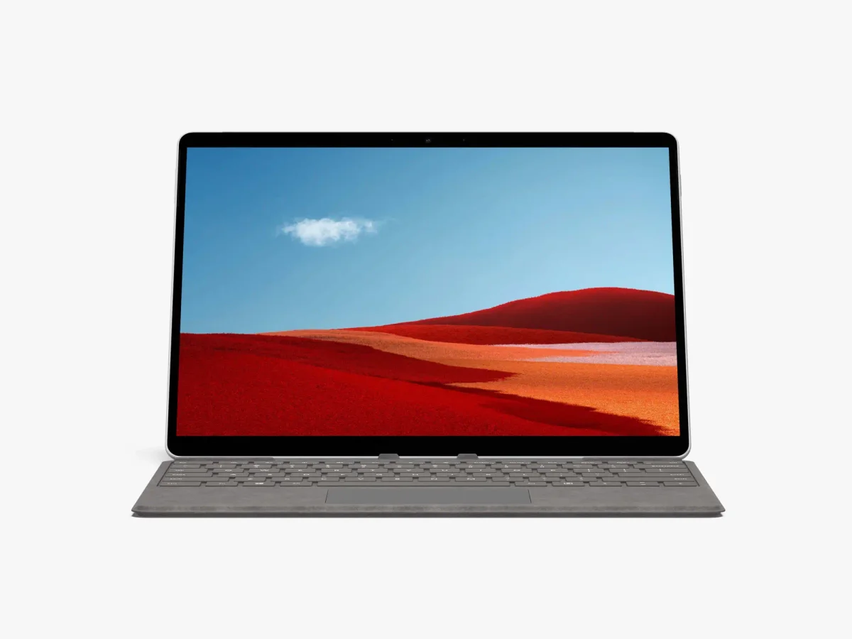 Surface Pro front view in laptop mode, featuring the desert landscape on the screen and the gray keyboard.