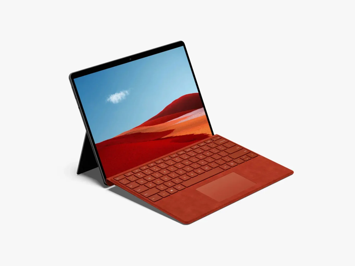 Surface Pro with a red keyboard, angled to display the desert landscape on the screen.